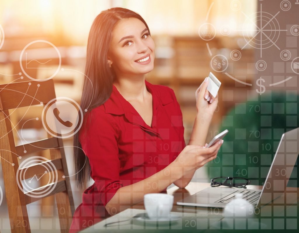 Business woman shopping online Young business woman holding mobile phone and credit card. Woman pays for a purchase with credit card and looking in camera. Purchase and shopping online. Business infographic